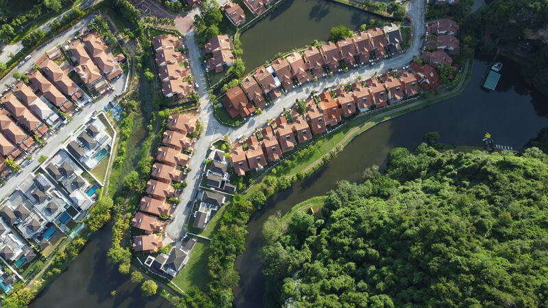 Aerial view of Lakeside Villas alongside the river and greenery